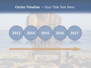 A Wooden Chair Sitting On Top Of A Sandy Beach PowerPoint Template