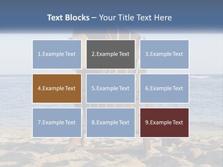 A Wooden Chair Sitting On Top Of A Sandy Beach PowerPoint Template