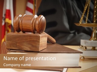 A Wooden Judge's Gavel On Top Of A Book PowerPoint Template