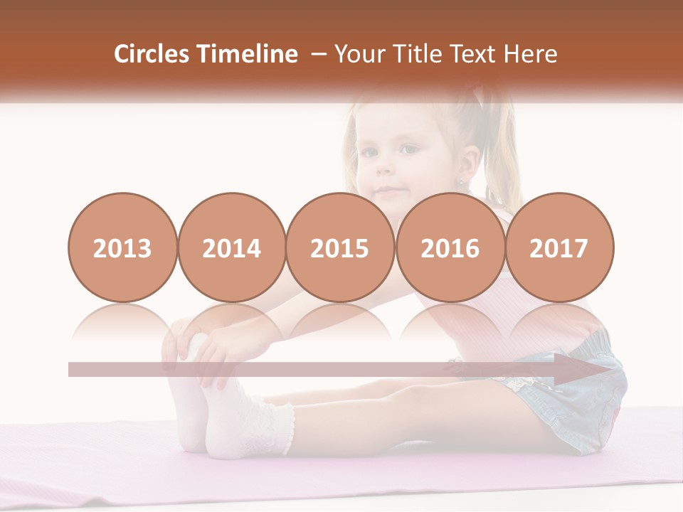 A Little Girl Sitting On A Mat With Her Feet On The Ground PowerPoint Template