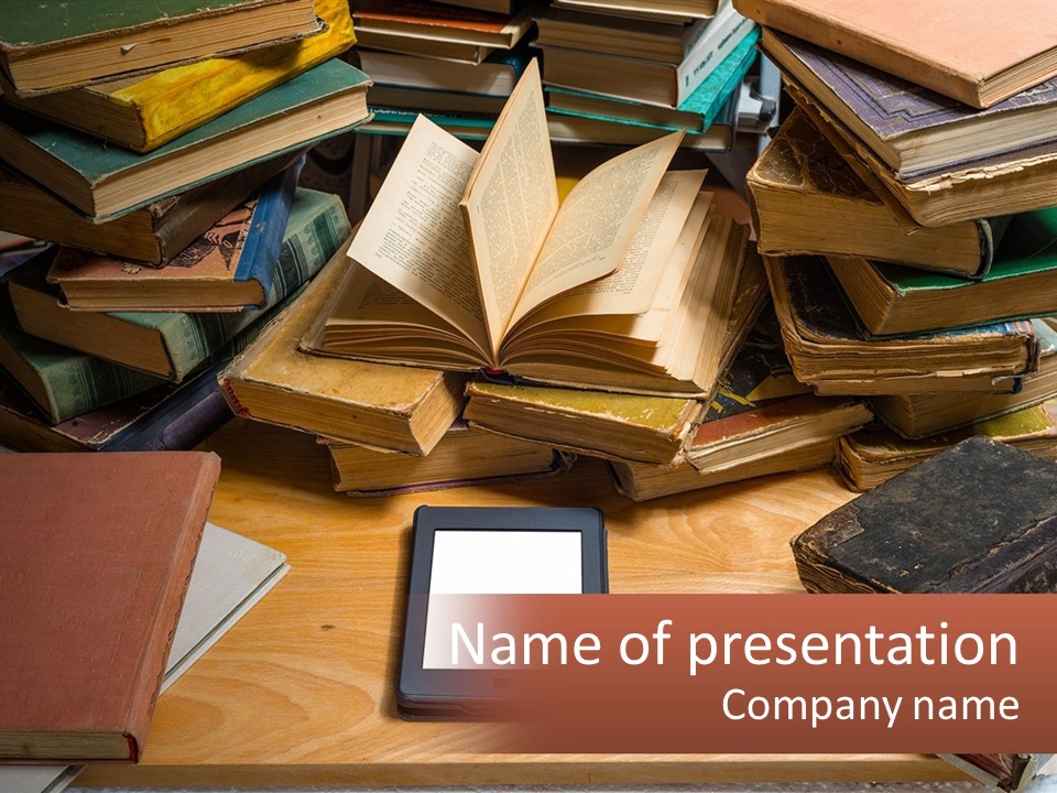 A Pile Of Books And A Tablet On A Table PowerPoint Template