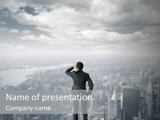 A Man Standing On Top Of A Tall Building PowerPoint Template