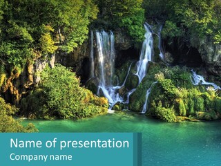 A Waterfall In The Middle Of A Body Of Water PowerPoint Template