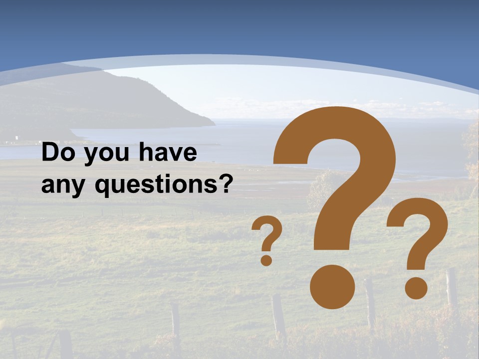 A Green Field With A Lake In The Background PowerPoint Template