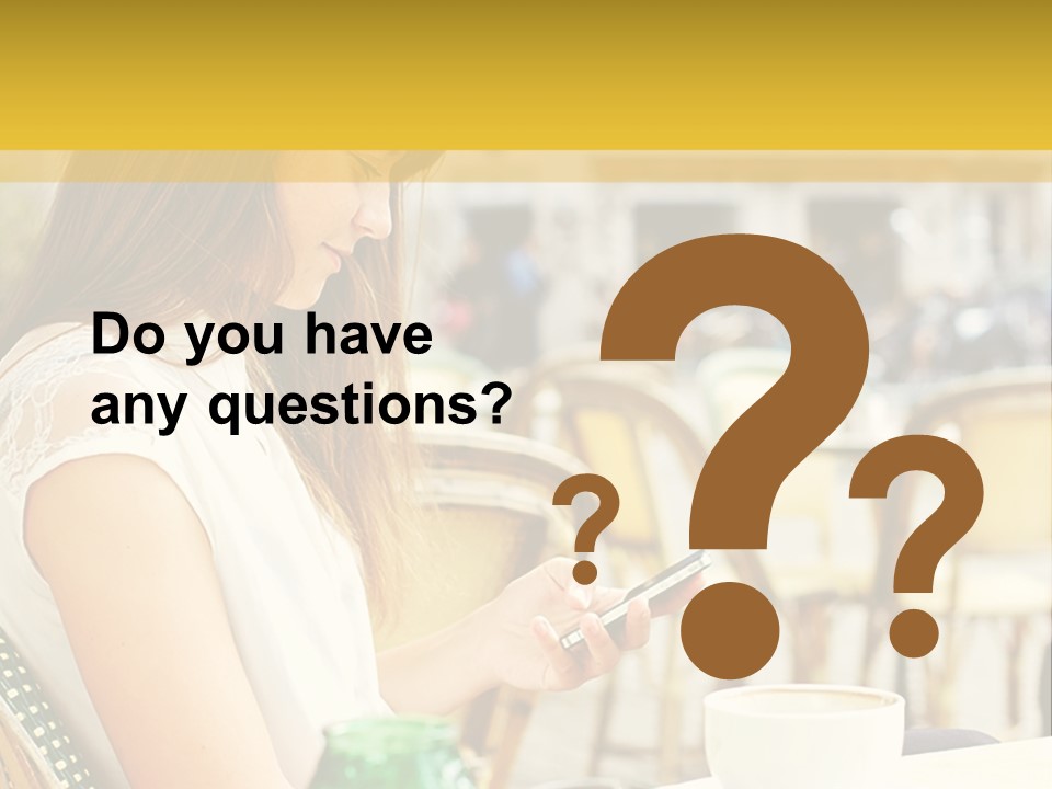 A Woman Sitting At A Table Using A Cell Phone PowerPoint Template