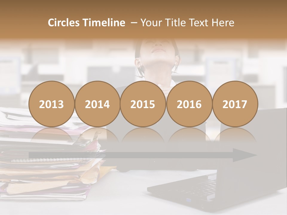 A Woman Sitting In Front Of A Laptop Computer PowerPoint Template