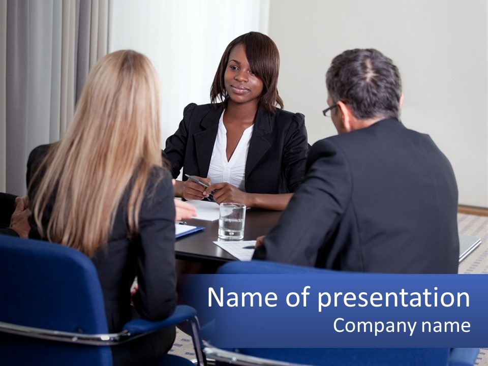 A Group Of People Sitting Around A Table Talking PowerPoint Template