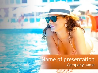 A Woman In A Hat And Sunglasses Sitting Next To A Pool PowerPoint Template