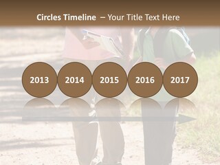 A Man And A Boy Walking Down A Dirt Road PowerPoint Template