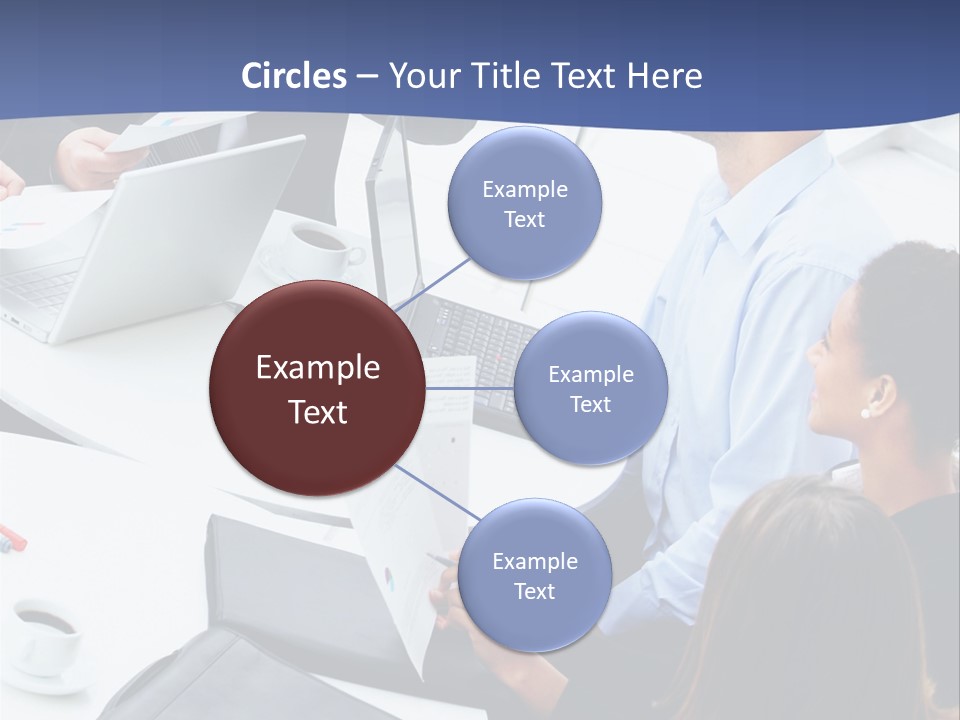 A Group Of People Sitting Around A Table With Laptops PowerPoint Template