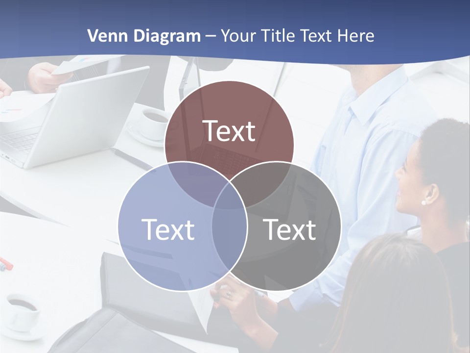 A Group Of People Sitting Around A Table With Laptops PowerPoint Template