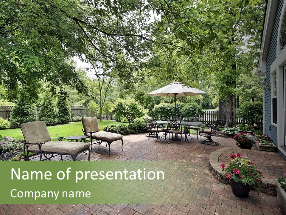 A Brick Patio With Chairs And An Umbrella PowerPoint Template