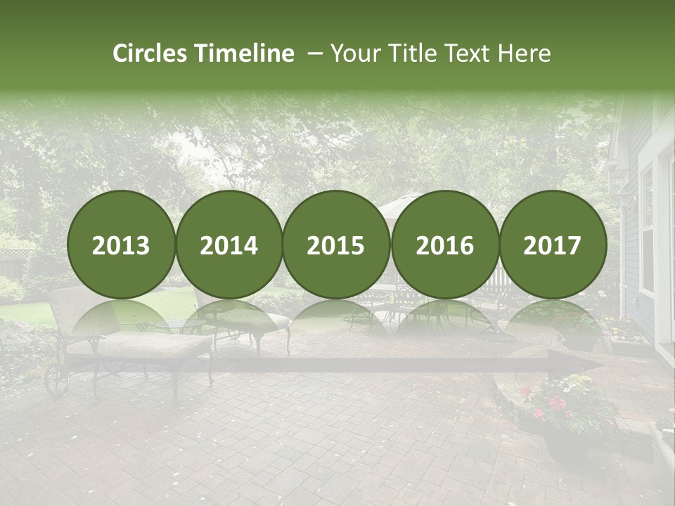 A Brick Patio With Chairs And An Umbrella PowerPoint Template