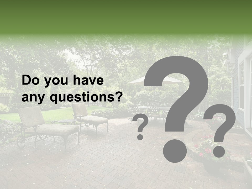 A Brick Patio With Chairs And An Umbrella PowerPoint Template