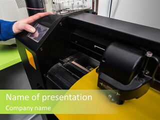 A Person Using A Large Machine To Print A Piece Of Paper PowerPoint Template