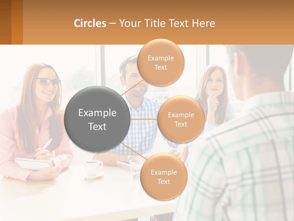 A Group Of People Sitting Around A Table PowerPoint Template