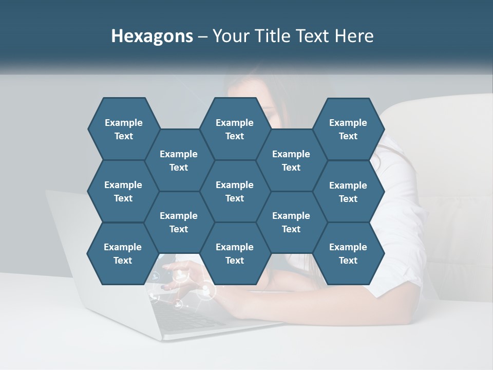 A Woman Sitting At A Desk Using A Laptop Computer PowerPoint Template