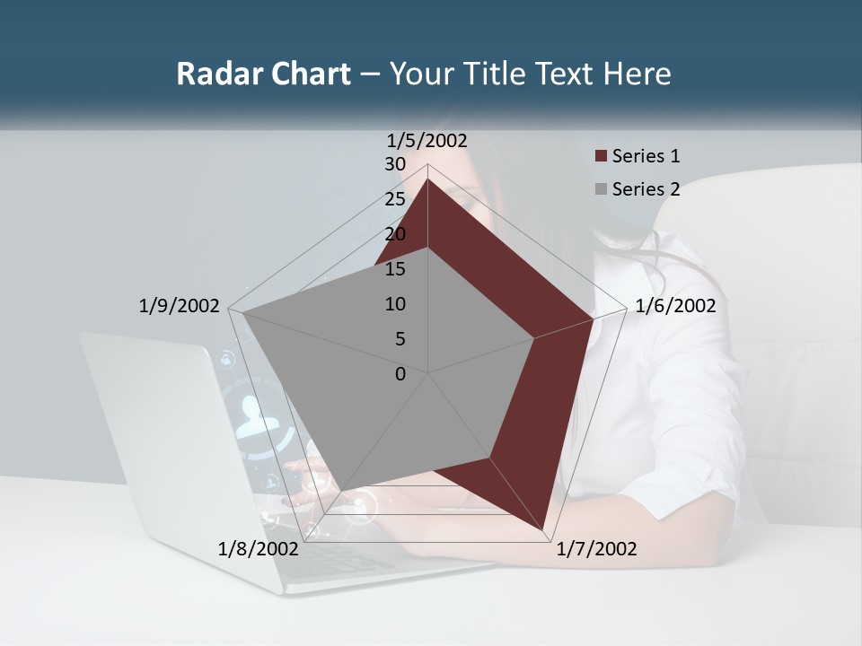 A Woman Sitting At A Desk Using A Laptop Computer PowerPoint Template