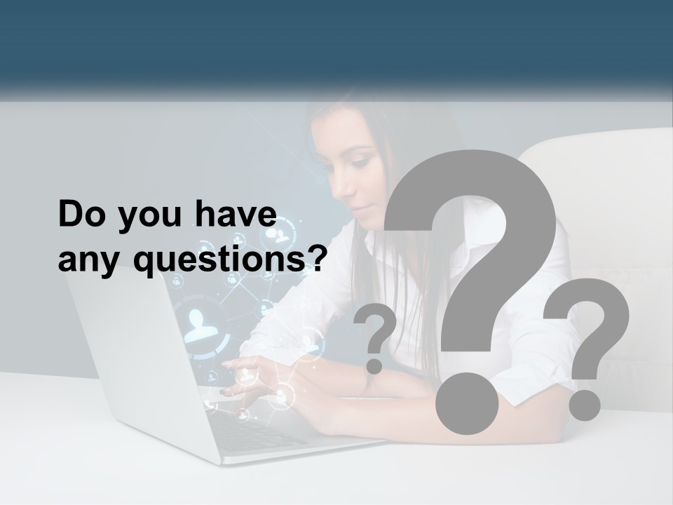 A Woman Sitting At A Desk Using A Laptop Computer PowerPoint Template