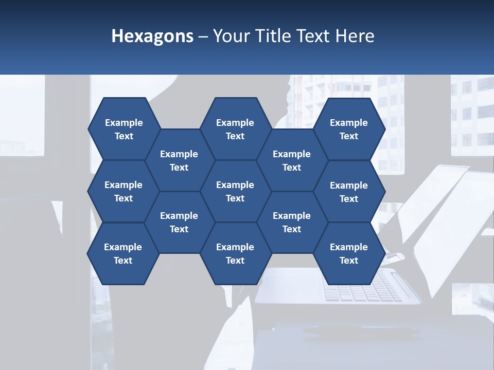 A Man Sitting In Front Of A Laptop Computer PowerPoint Template