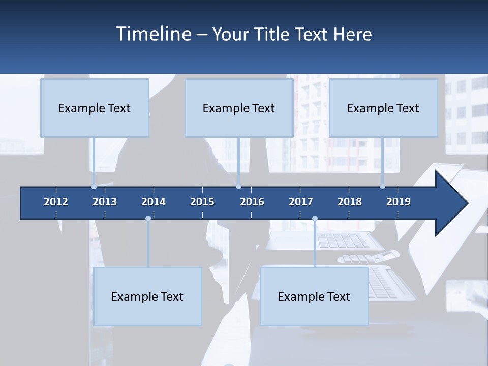 A Man Sitting In Front Of A Laptop Computer PowerPoint Template