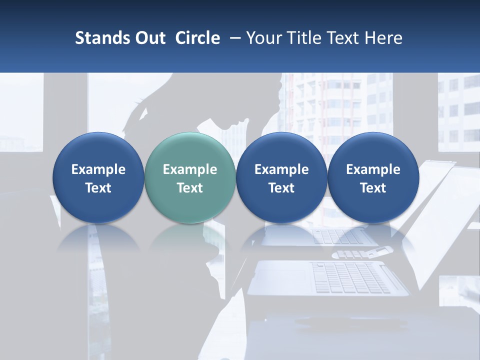 A Man Sitting In Front Of A Laptop Computer PowerPoint Template