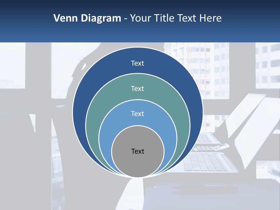 A Man Sitting In Front Of A Laptop Computer PowerPoint Template