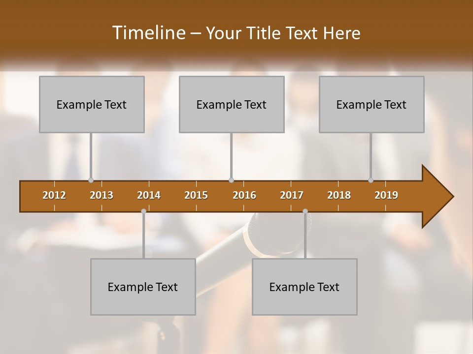 A Microphone In Front Of A Group Of People PowerPoint Template