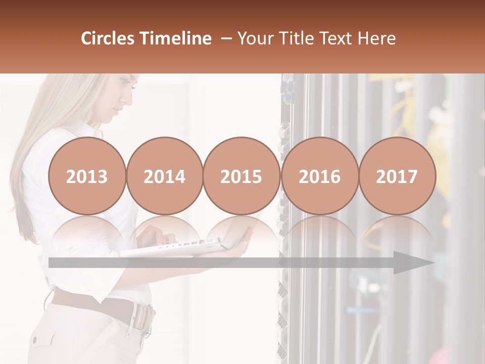 A Woman Is Holding A Laptop In Front Of A Server PowerPoint Template