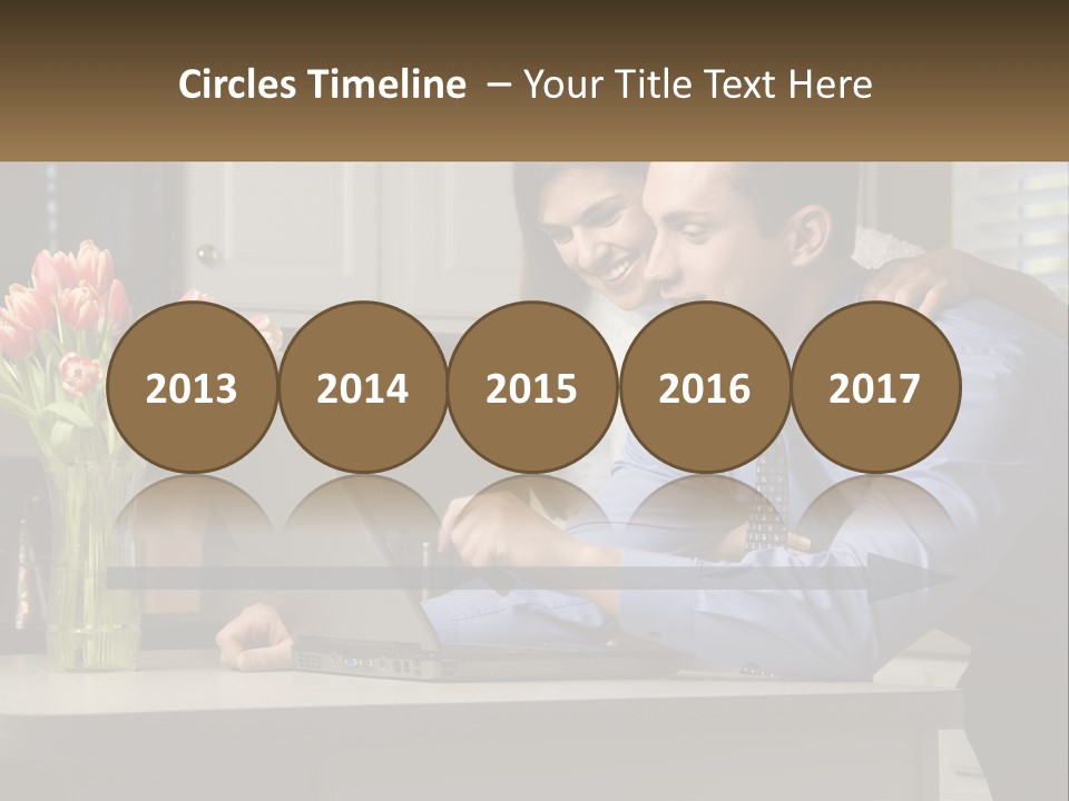 A Man And Woman Looking At A Laptop Computer PowerPoint Template