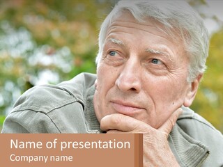 An Elderly Man Is Looking At The Camera With His Hand On His Chin PowerPoint Template