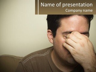 A Man Covering His Face With His Hands PowerPoint Template