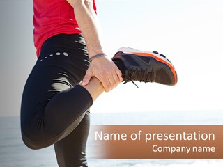 A Person Standing On A Beach With Their Feet In The Air PowerPoint Template