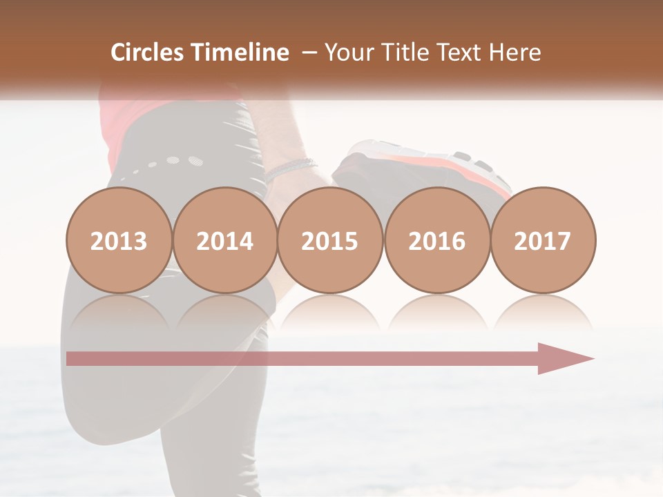 A Person Standing On A Beach With Their Feet In The Air PowerPoint Template