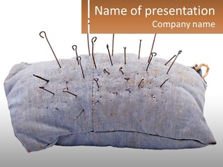 A Pillow With Pins Sticking Out Of It PowerPoint Template