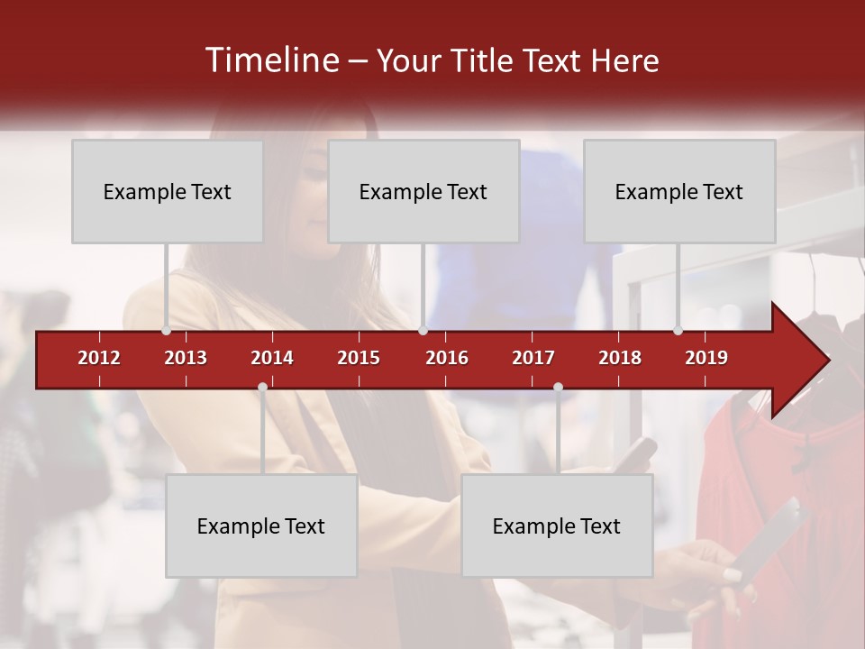 A Woman Looking At A Cell Phone In A Clothing Store PowerPoint Template