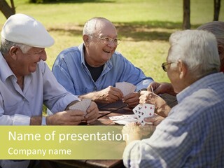 A Group Of Elderly Men Playing Cards At A Picnic Table PowerPoint Template