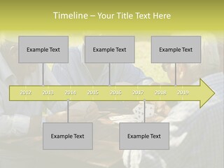A Group Of Elderly Men Playing Cards At A Picnic Table PowerPoint Template