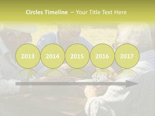 A Group Of Elderly Men Playing Cards At A Picnic Table PowerPoint Template