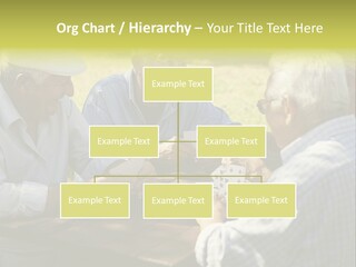 A Group Of Elderly Men Playing Cards At A Picnic Table PowerPoint Template