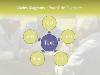 A Group Of Elderly Men Playing Cards At A Picnic Table PowerPoint Template