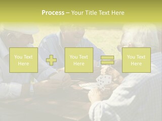 A Group Of Elderly Men Playing Cards At A Picnic Table PowerPoint Template