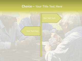A Group Of Elderly Men Playing Cards At A Picnic Table PowerPoint Template