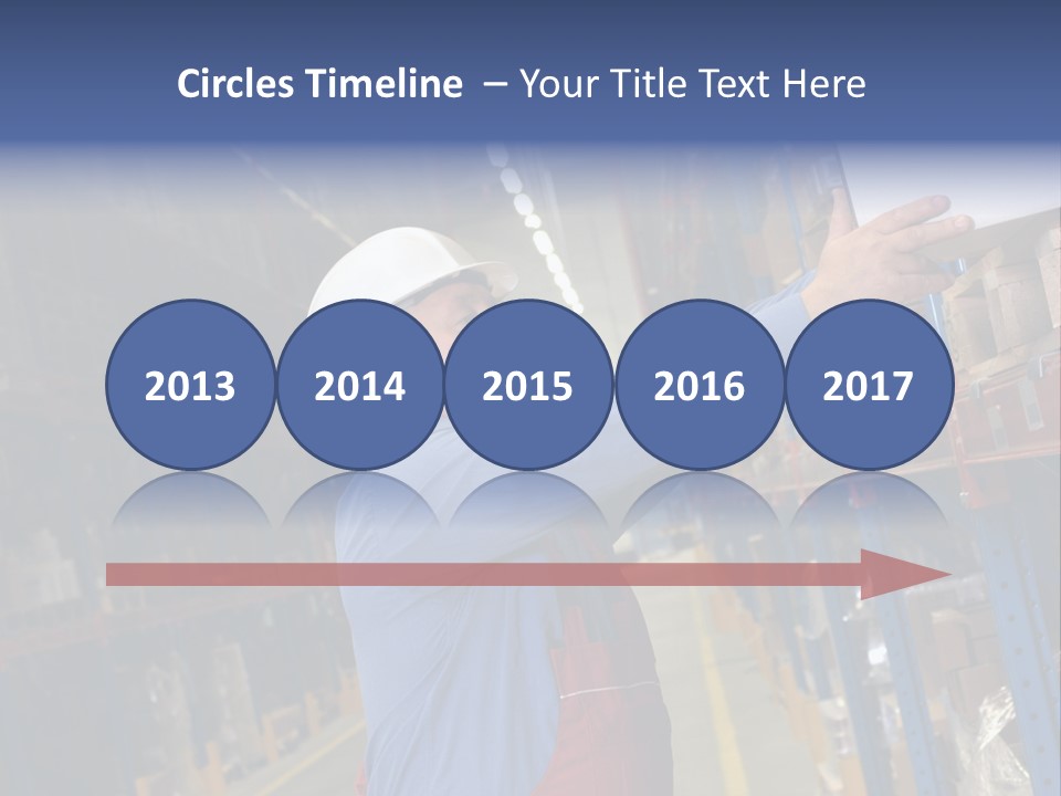 A Man In A Warehouse Is Looking At A Piece Of Paper PowerPoint Template