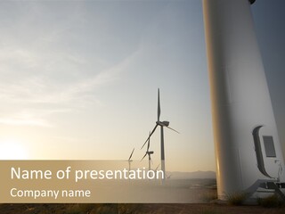 A Wind Farm With Windmills In The Background PowerPoint Template