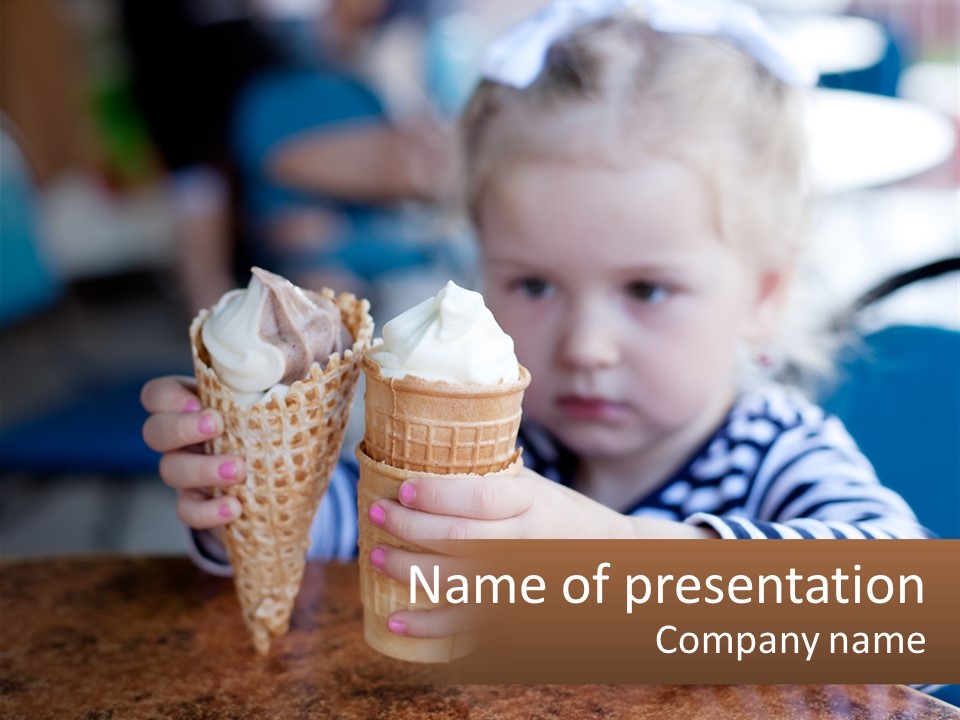 A Little Girl Sitting At A Table With Two Ice Cream Cones PowerPoint Template