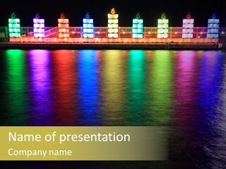 A Large Body Of Water With Colorful Lights On It PowerPoint Template