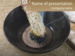 A Black Bowl With A Plant Inside Of It PowerPoint Template