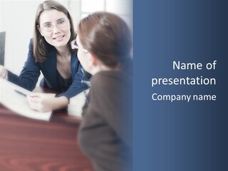 A Woman Sitting At A Desk Talking To Another Woman PowerPoint Template