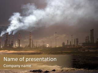 A Power Plant With Smoke Coming Out Of It PowerPoint Template